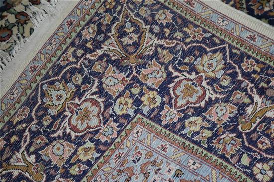 A Persian Tree of life ivory ground carpet W.275 x 180cm